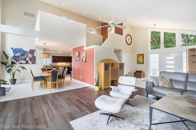 7025 Dandison Blvd, West Bloomfield, MI 48324 - living area with a towering ceiling, wood finished floors, ceiling fan, and recessed lighting