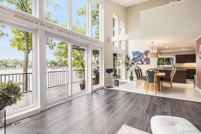 7025 Dandison Blvd, West Bloomfield, MI 48324 - sunroom / solarium with a water view and plenty of natural light