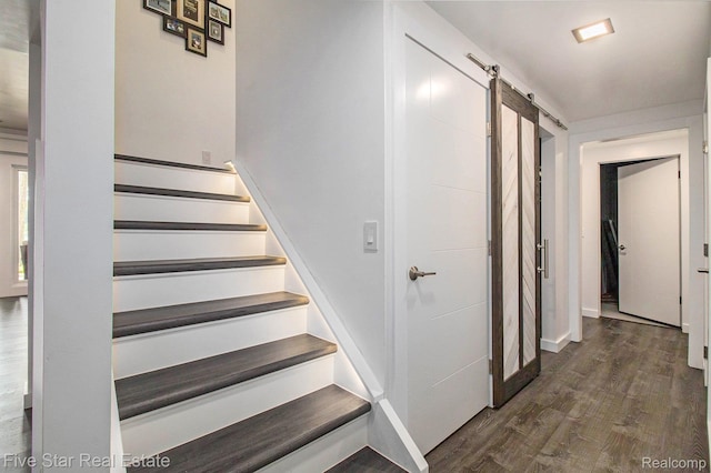 7025 Dandison Blvd, West Bloomfield, MI 48324 - stairway with a barn door and wood finished floors