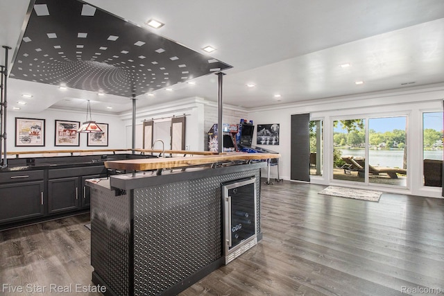 7025 Dandison Blvd, West Bloomfield, MI 48324 - kitchen featuring beverage cooler, dark wood-style flooring, crown molding, dark countertops, and pendant lighting
