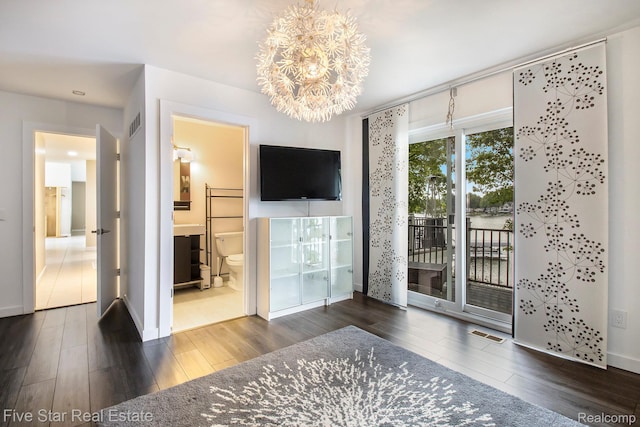 7025 Dandison Blvd, West Bloomfield, MI 48324 - unfurnished bedroom with access to exterior, wood finished floors, a chandelier, and ensuite bathroom