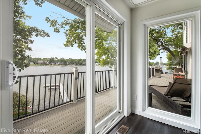 7025 Dandison Blvd, West Bloomfield, MI 48324 - doorway to outside with a water view, healthy amount of natural light, and dark wood-style floors
