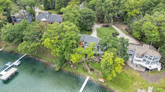 7025 Dandison Blvd, West Bloomfield, MI 48324 - aerial overview of property's location with a nearby body of water and a tree filled landscape