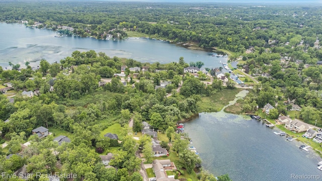 7025 Dandison Blvd, West Bloomfield, MI 48324 - aerial overview of property's location featuring a large body of water and nearby suburban area