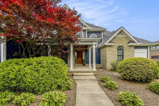 6577 Heron Ct, Ann Arbor, MI 48103 - view of front of house with stone siding and a porch