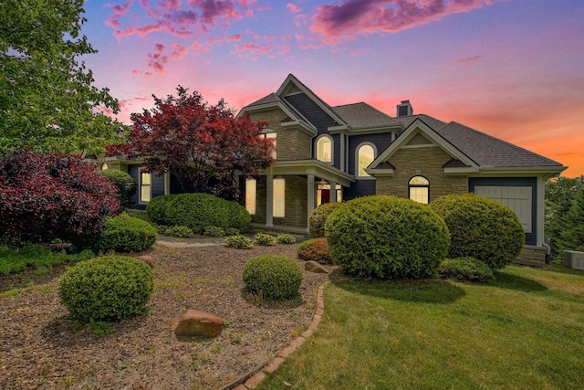 6577 Heron Ct, Ann Arbor, MI 48103 - view of front of home with stone siding, a chimney, and a yard