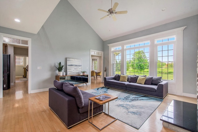 6577 Heron Ct, Ann Arbor, MI 48103 - living room with high vaulted ceiling, plenty of natural light, light wood-type flooring, a ceiling fan, and recessed lighting