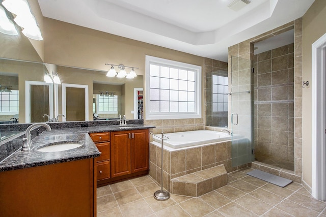 6577 Heron Ct, Ann Arbor, MI 48103 - full bath with a stall shower, double vanity, a bath, tile patterned flooring, and a tray ceiling