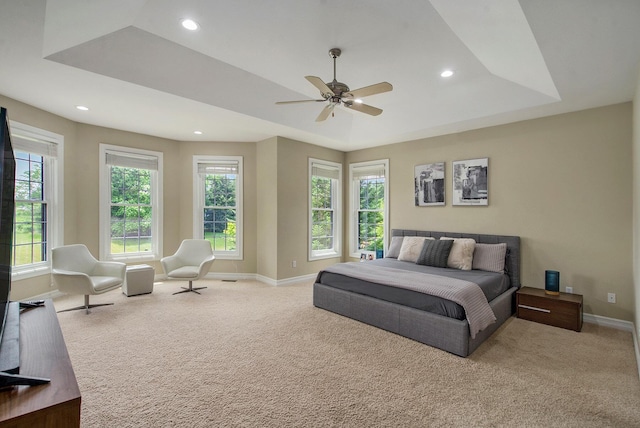 6577 Heron Ct, Ann Arbor, MI 48103 - carpeted bedroom featuring multiple windows, recessed lighting, a raised ceiling, and ceiling fan