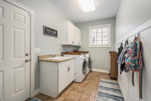 6577 Heron Ct, Ann Arbor, MI 48103 - washroom with washing machine and clothes dryer and cabinet space
