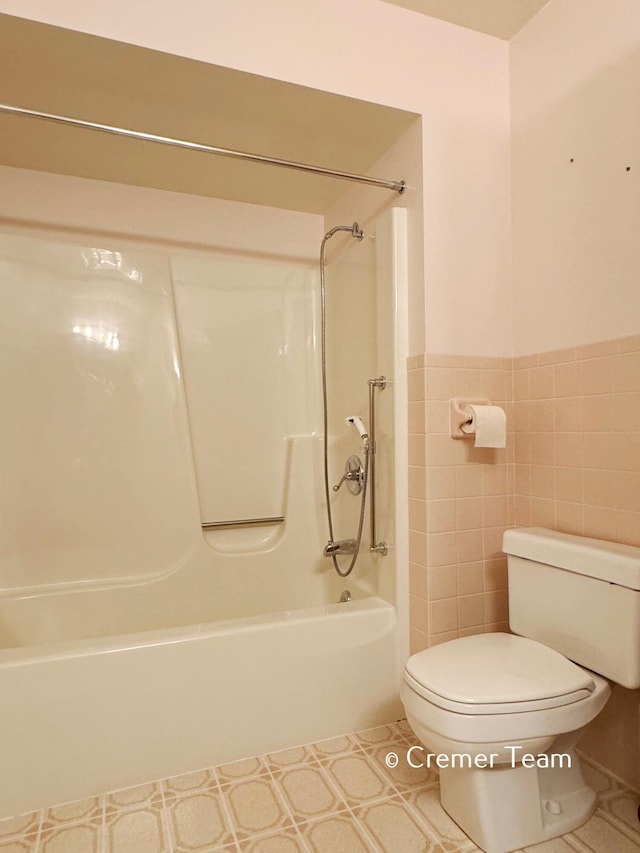 4074 Grandview Ter SW, Grandville, MI 49418 - bathroom with bathtub / shower combination and tile patterned floors