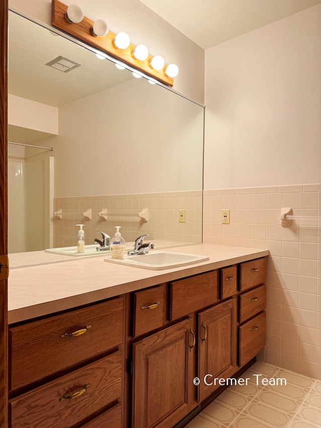 4074 Grandview Ter SW, Grandville, MI 49418 - bathroom with vanity and tile walls