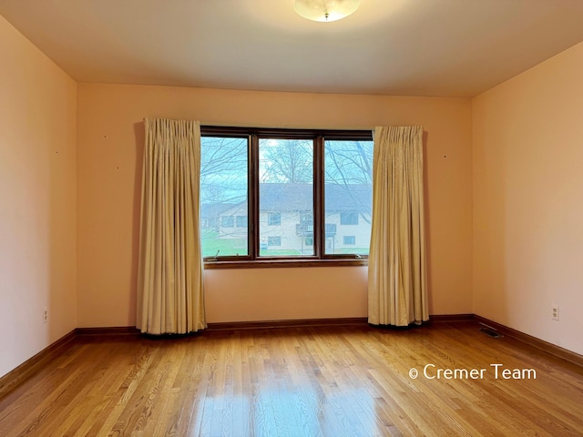 4074 Grandview Ter SW, Grandville, MI 49418 - empty room featuring wood finished floors and baseboards