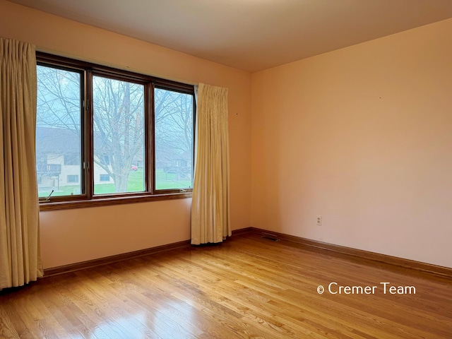 4074 Grandview Ter SW, Grandville, MI 49418 - empty room with light wood-style flooring and baseboards
