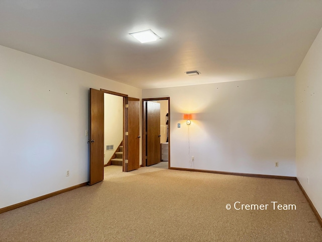 4074 Grandview Ter SW, Grandville, MI 49418 - carpeted spare room featuring baseboards and stairs
