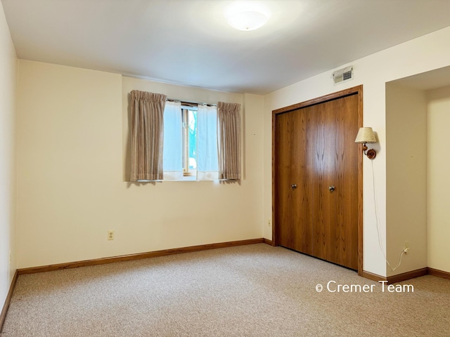 4074 Grandview Ter SW, Grandville, MI 49418 - unfurnished bedroom featuring a closet and carpet flooring