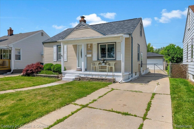 1678 Merrill Ave, Lincoln Park, MI 48146 - bungalow with covered porch, a shingled roof, a chimney, a garage, and an outbuilding