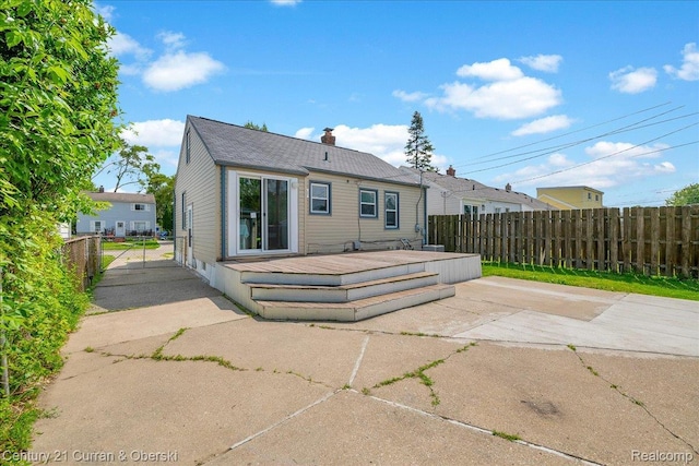1678 Merrill Ave, Lincoln Park, MI 48146 - rear view of property with a wooden deck, a patio, a chimney, and a gate