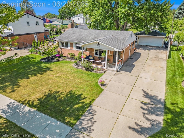 12141 Danforth Dr, Sterling Heights, MI 48312 - view of front facade with covered porch, brick siding, a front lawn, a garage, and roof with shingles