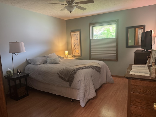 7337 Pine Grove Dr, Jenison, MI 49428 - bedroom with a textured ceiling, wood finished floors, and a ceiling fan