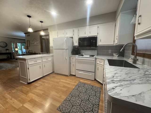 7337 Pine Grove Dr, Jenison, MI 49428 - kitchen featuring white appliances, a peninsula, light wood-style floors, white cabinets, and tasteful backsplash