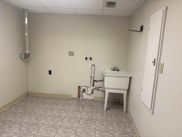 7337 Pine Grove Dr, Jenison, MI 49428 - laundry room featuring baseboards