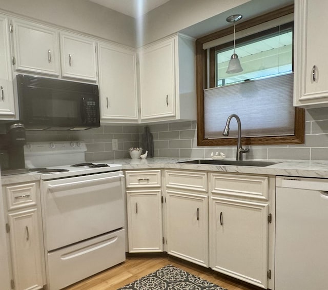 7337 Pine Grove Dr, Jenison, MI 49428 - kitchen with white appliances, light wood-type flooring, backsplash, decorative light fixtures, and white cabinets