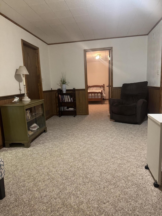 7337 Pine Grove Dr, Jenison, MI 49428 - carpeted living room with a wainscoted wall, wood walls, and ornamental molding