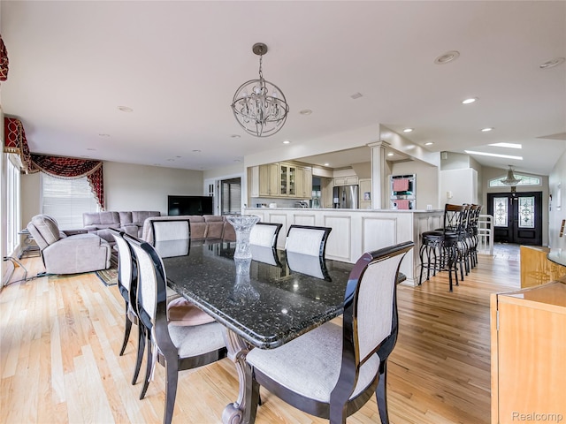 7660 Barnsbury Dr, West Bloomfield, MI 48324 - dining area featuring a chandelier, light wood-style flooring, lofted ceiling, and recessed lighting