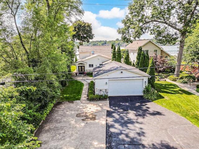 7660 Barnsbury Dr, West Bloomfield, MI 48324 - view of front of property featuring driveway, a front yard, and an attached garage