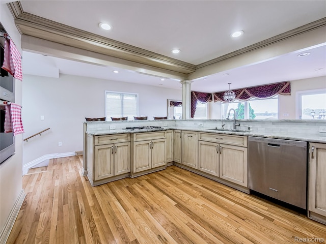 7660 Barnsbury Dr, West Bloomfield, MI 48324 - kitchen featuring appliances with stainless steel finishes, ornamental molding, light wood finished floors, ornate columns, and recessed lighting