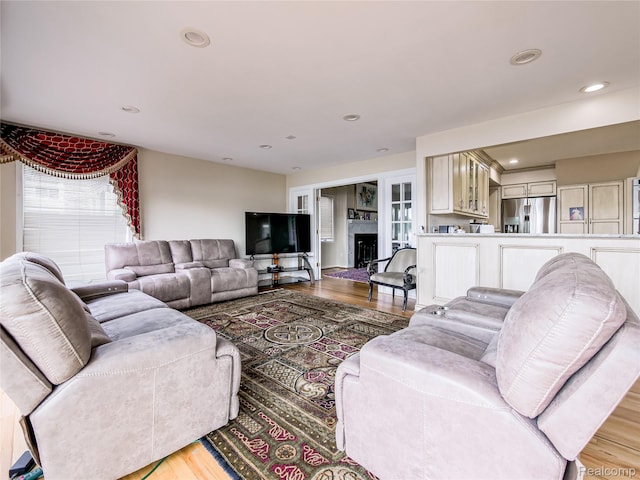 7660 Barnsbury Dr, West Bloomfield, MI 48324 - living room with light wood-style floors, healthy amount of natural light, and recessed lighting