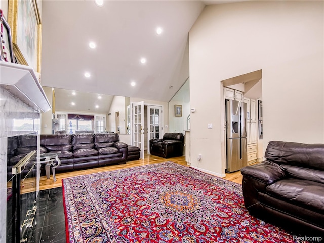 7660 Barnsbury Dr, West Bloomfield, MI 48324 - living area featuring high vaulted ceiling, a fireplace, recessed lighting, and light wood finished floors