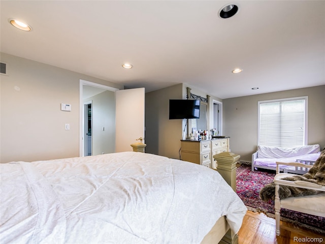 7660 Barnsbury Dr, West Bloomfield, MI 48324 - bedroom with wood finished floors and recessed lighting