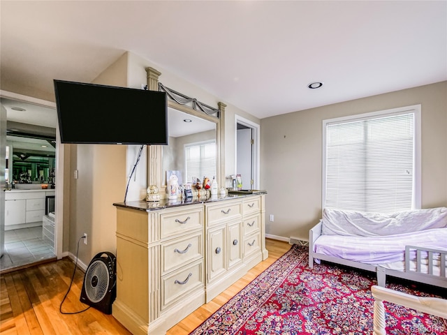 7660 Barnsbury Dr, West Bloomfield, MI 48324 - bedroom featuring light wood-style flooring and baseboards