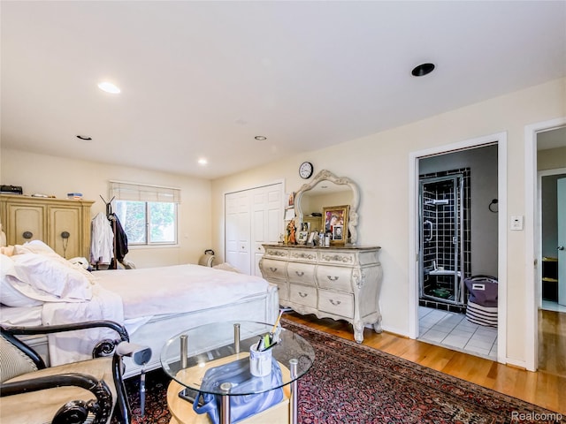 7660 Barnsbury Dr, West Bloomfield, MI 48324 - bedroom with light wood finished floors, a closet, and recessed lighting