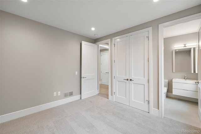 345 Kimberly St, Birmingham, MI 48009 - unfurnished bedroom featuring light carpet, recessed lighting, and a closet