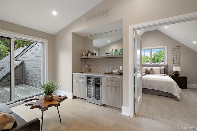 345 Kimberly St, Birmingham, MI 48009 - indoor wet bar with vaulted ceiling, beverage cooler, healthy amount of natural light, tasteful backsplash, and recessed lighting