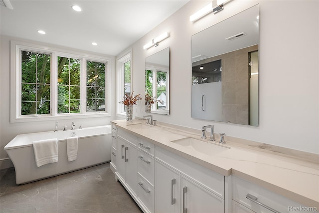 345 Kimberly St, Birmingham, MI 48009 - bathroom featuring double vanity, a soaking tub, and recessed lighting