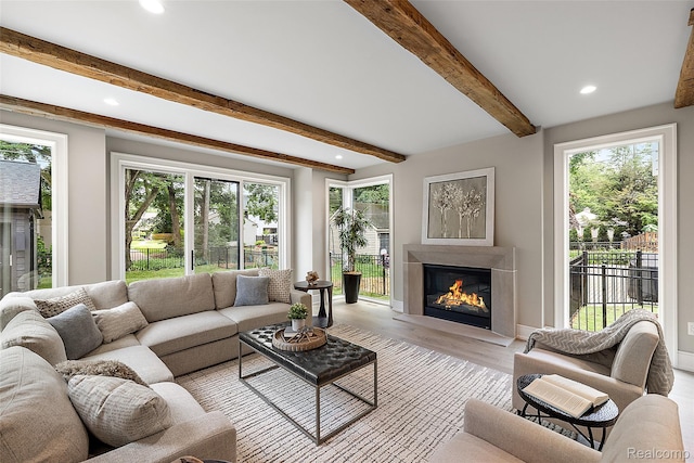 345 Kimberly St, Birmingham, MI 48009 - living room featuring recessed lighting, a glass covered fireplace, light wood-style floors, and beamed ceiling