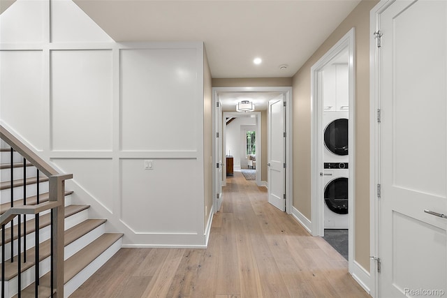 345 Kimberly St, Birmingham, MI 48009 - hallway with stacked washing machine and dryer, light wood finished floors, stairway, and recessed lighting