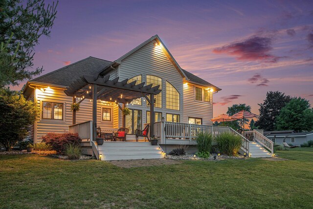 1256 Barron Lake Rd, Niles, MI 49120 - back of property at dusk with a pergola, a wooden deck, and a yard