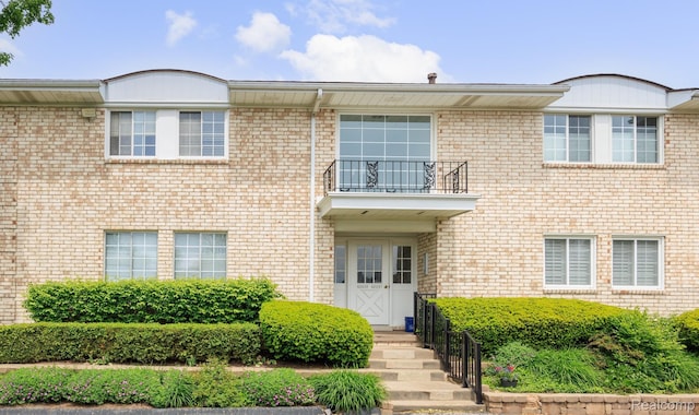42309 Woodward Ave Unit S1-7, Bloomfield Hills, MI 48304 - view of front of house with a balcony and brick siding