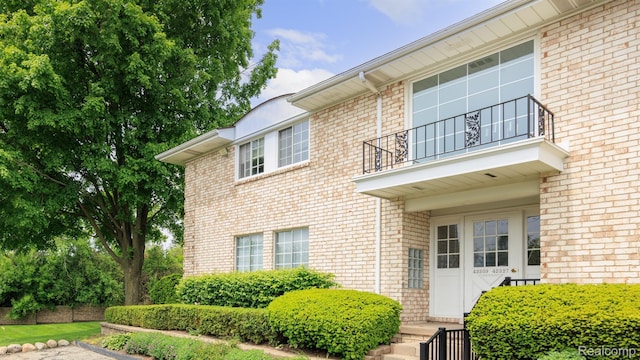 42309 Woodward Ave Unit S1-7, Bloomfield Hills, MI 48304 - view of front of property with a balcony and brick siding