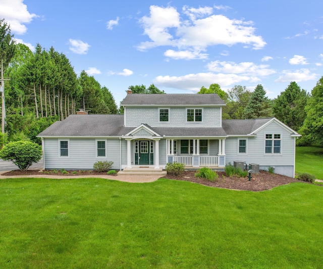 4641 Wylie Rd, Dexter, MI 48130 - view of front of property featuring a porch, a front lawn, and a chimney