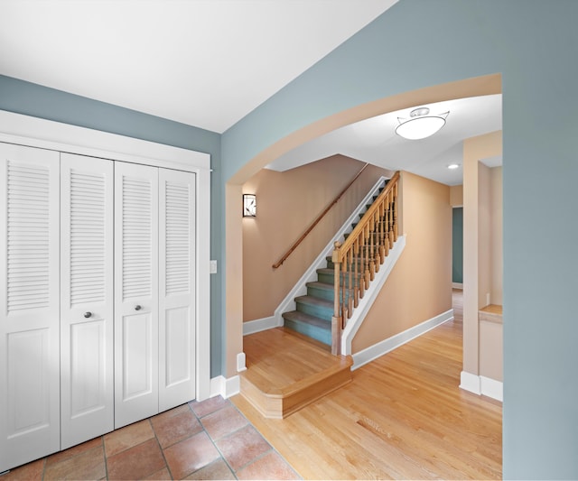 4641 Wylie Rd, Dexter, MI 48130 - stairway with arched walkways and wood finished floors