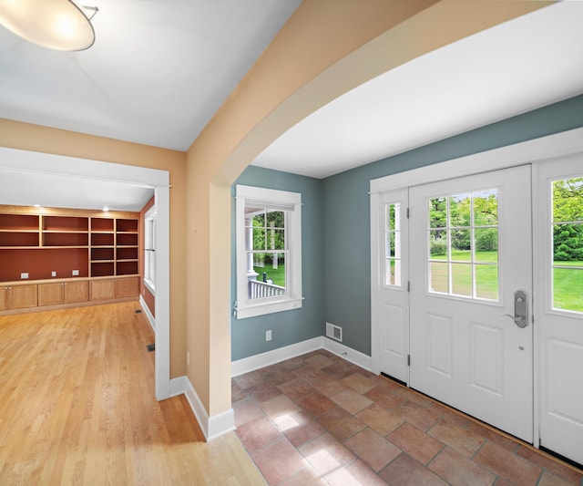 4641 Wylie Rd, Dexter, MI 48130 - entryway featuring arched walkways and baseboards