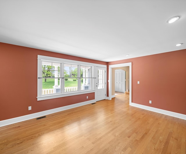 4641 Wylie Rd, Dexter, MI 48130 - spare room with light wood-type flooring and arched walkways