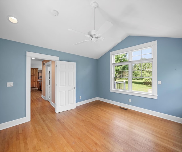 4641 Wylie Rd, Dexter, MI 48130 - spare room featuring a ceiling fan, light wood-style flooring, lofted ceiling, and a smoke detector