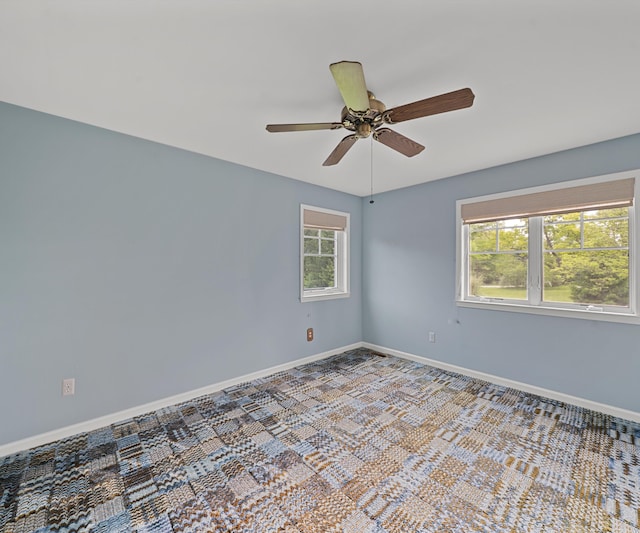 4641 Wylie Rd, Dexter, MI 48130 - carpeted spare room with a ceiling fan and baseboards
